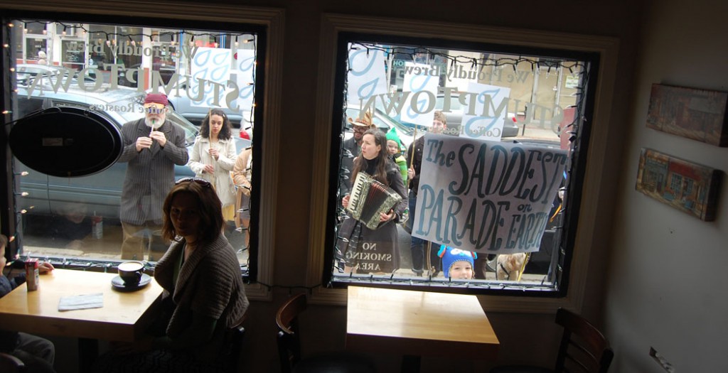 The parade as seen from inside Gusto Café on Cabot Street.