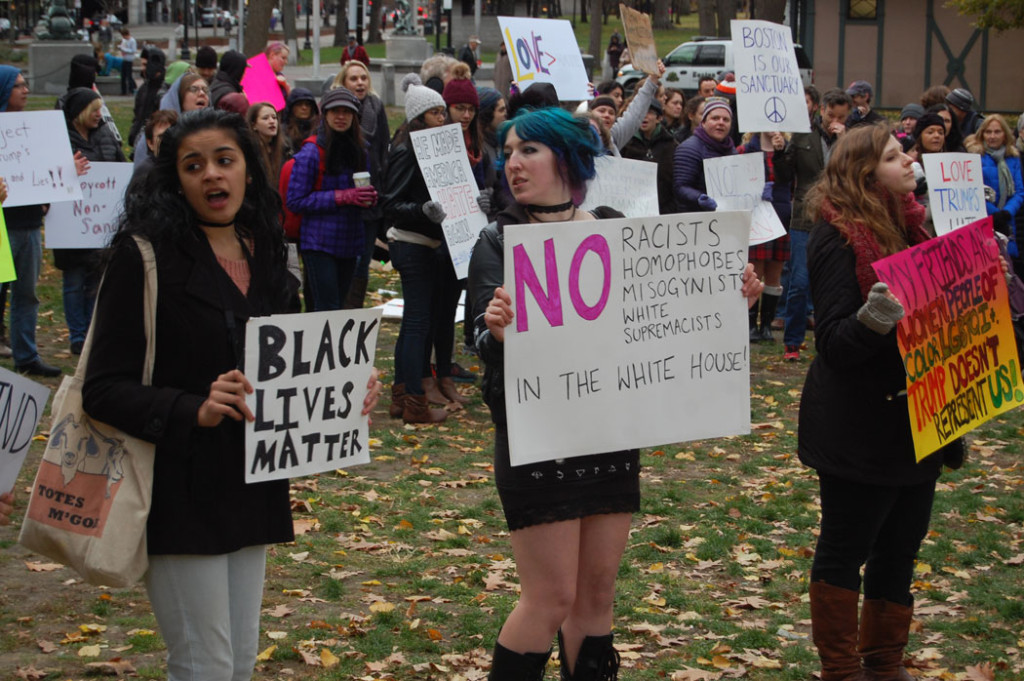 "Black Lives Matter." "No racists, homophobes, misogynists, white supremacitsts in the White House!" "My friends are women, people of color and LGBTQI+. Trump doesn't represent us!" At "Love Trumps Hate" rally at Boston Common, Nov. 20, 2016. (Greg Cook)
