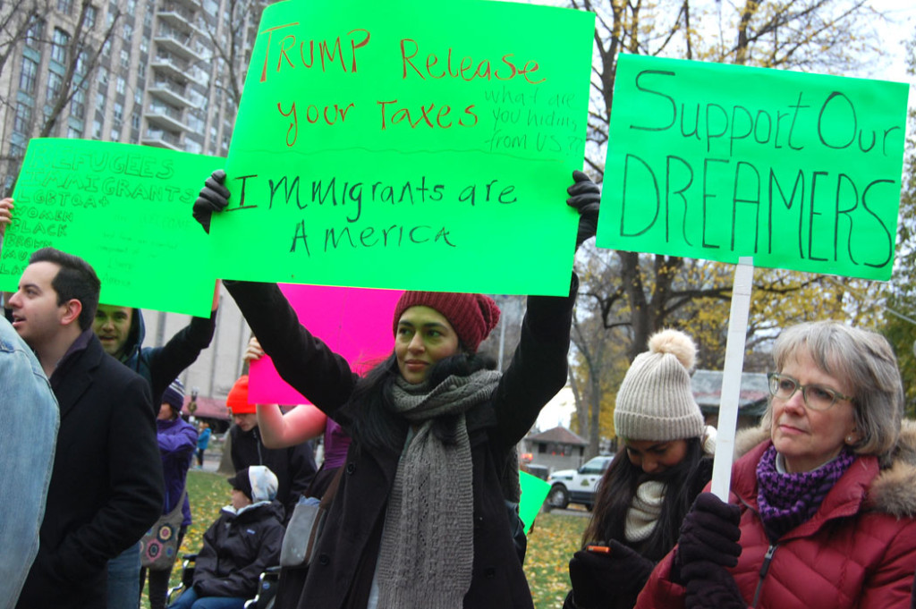 "Trump release your taxes. What are you hiding from US?? Immigrants are America." "Support our dreamers." At "Love Trumps Hate" rally at Boston Common, Nov. 20, 2016. (Greg Cook)