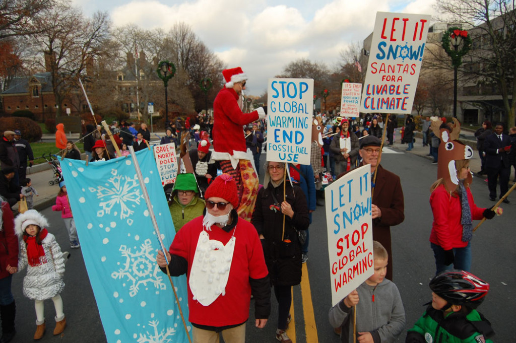 “Let It Snow! Santas Against Global Warming!” group in Malden’s annual Parade of Holiday Traditions, Nov. 26, 2016. (Greg Cook)