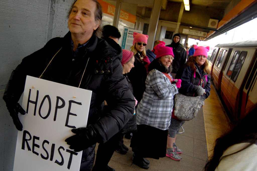 Preparing to board the train to the "Boston Women's March," Jan. 21, 2017. (Greg Cook)