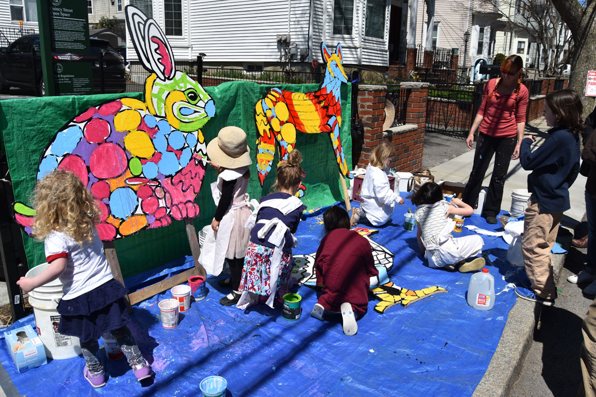 Painting mosaic-style animals designed by muralist Liz LaManche (in red at right) at the Starting Over Festival, Somerville, April 22, 2018. (Greg Cook)
