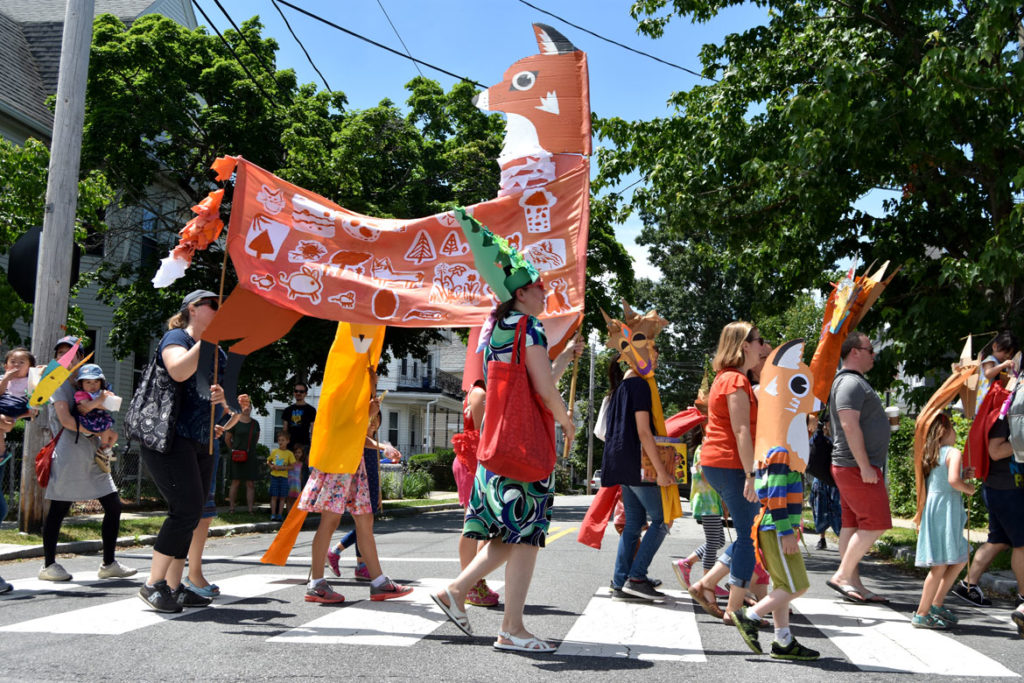 A giant fox puppet created by Wonderland Spectacle Co. (Kari Percival, Greg Cook) with help from local children in the Fox Festival Parade in Arlington, June 16, 2018. (Greg Cook)