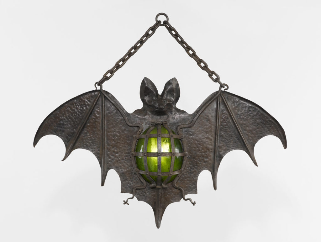 Cabaret Sign, “Bat,” France, possibly 19th century, modified in the 20th century. Wrought iron and rolled iron, carved and embossed, green glass,