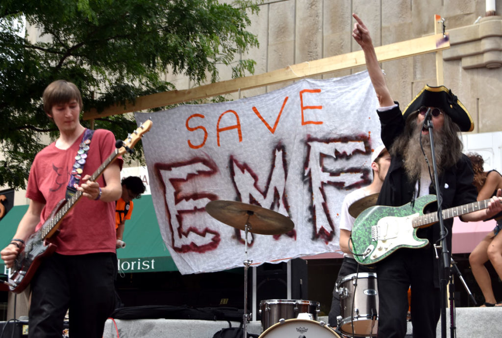 Jonee Earthquake Band plays at the "Save EMF" rally in Harvard Square, Cambridge, June 16, 2018. (Greg Cook)