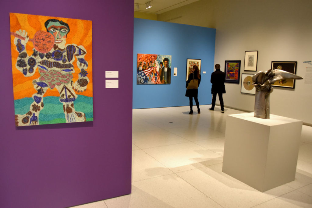 Pauline Simon’s painting “Tattooed Weight Lifter,” 1973 (left), and Richard Hunt’s welded steel sculpture “Winged Hybrid Figure No. 3,” 1965 (right), in "The Time is Now! Art Worlds of Chicago’s South Side, 1960–1980" at the Smart Museum of Art, The University of Chicago. (Greg Cook)