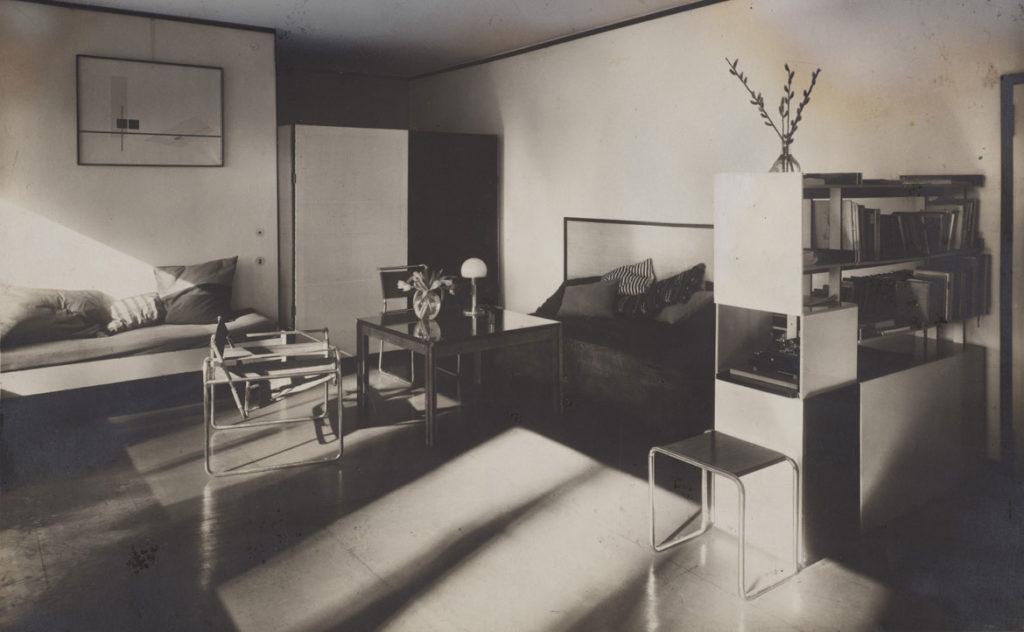 Lucia Moholy, “Bauhaus Masters Housing, Dessau, 1925–26: Lucia Moholy and László Moholy-Nagy's Living Room,” c. 1925, gelatin silver print with gouache retouchings. (© Lucia Moholy Estate/Artists Rights Society (ARS), New York/VG Bild-Kunst, Bonn. © President and Fellows of Harvard College)