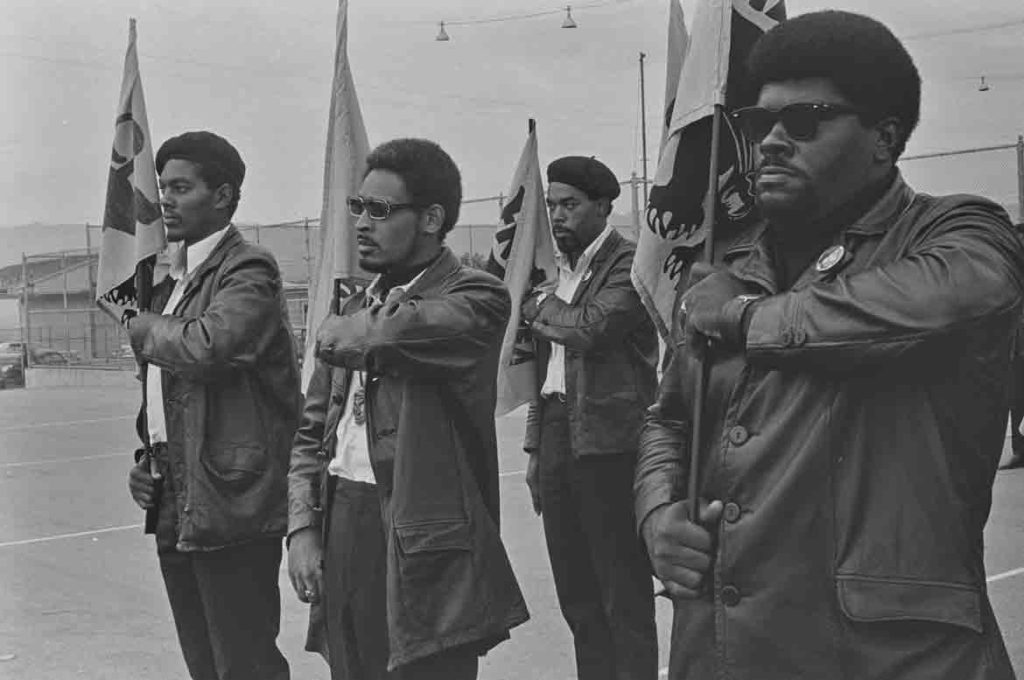 Pirkle Jones, "Black Panthers during drill, (far right, Elbert 'Big Man' Howard) De Fremery Park, Oakland, CA," July 28, 1968. (Courtesy University of California, Santa Cruz)