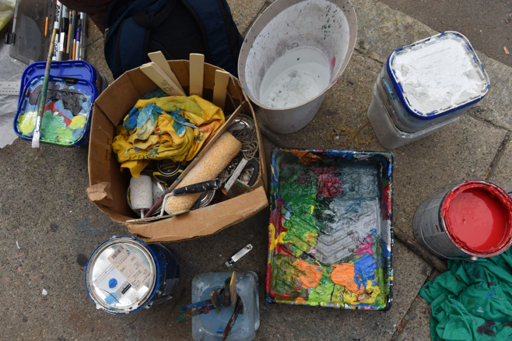 Pascal Michel's supplies for his mural on the side of Highland Creole Cuisine, 2 Highland Ave., Somerville, Aug. 28, 2019. (Greg Cook)