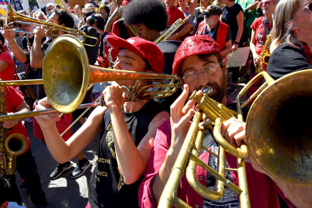 The Second Line Social Aid & Pleasure Society Brass Band plays at Boston Climate Strike, outside the Massachusetts State House, Sept. 20, 2019. (Greg Cook)