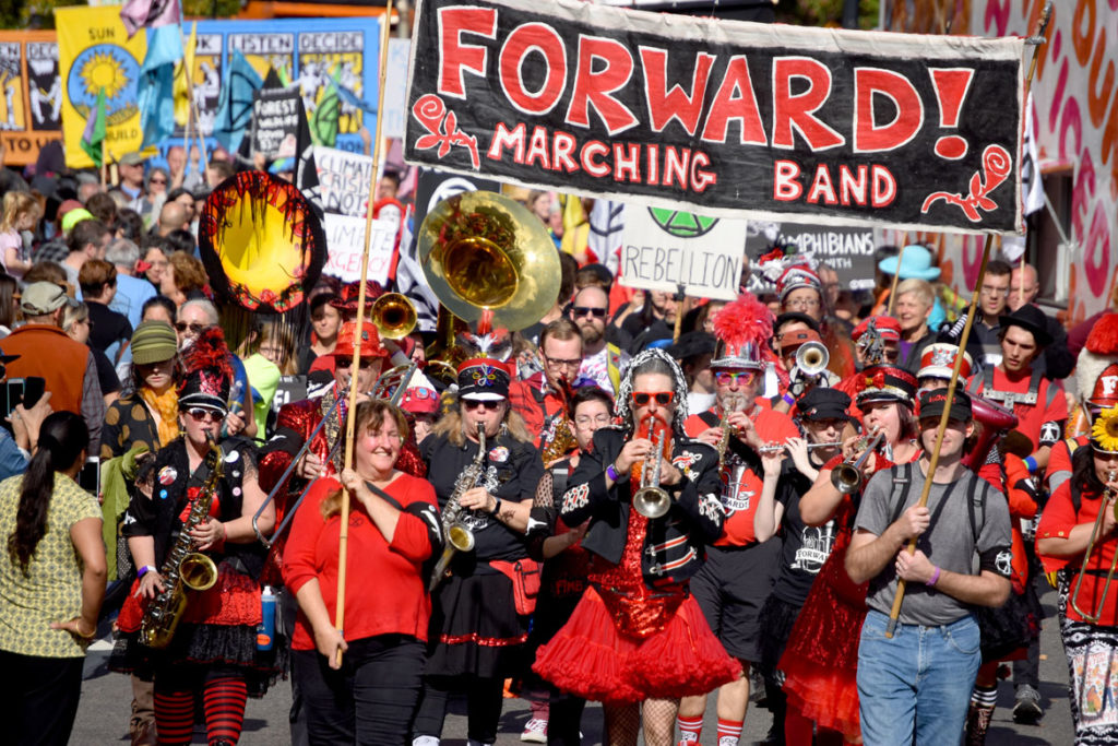 Forward! Marching Band from Madison, Wisconsin, reaches Harvard Square, Cambridge, during the Honk Parade, Oct. 13, 2019. (Greg Cook photo)