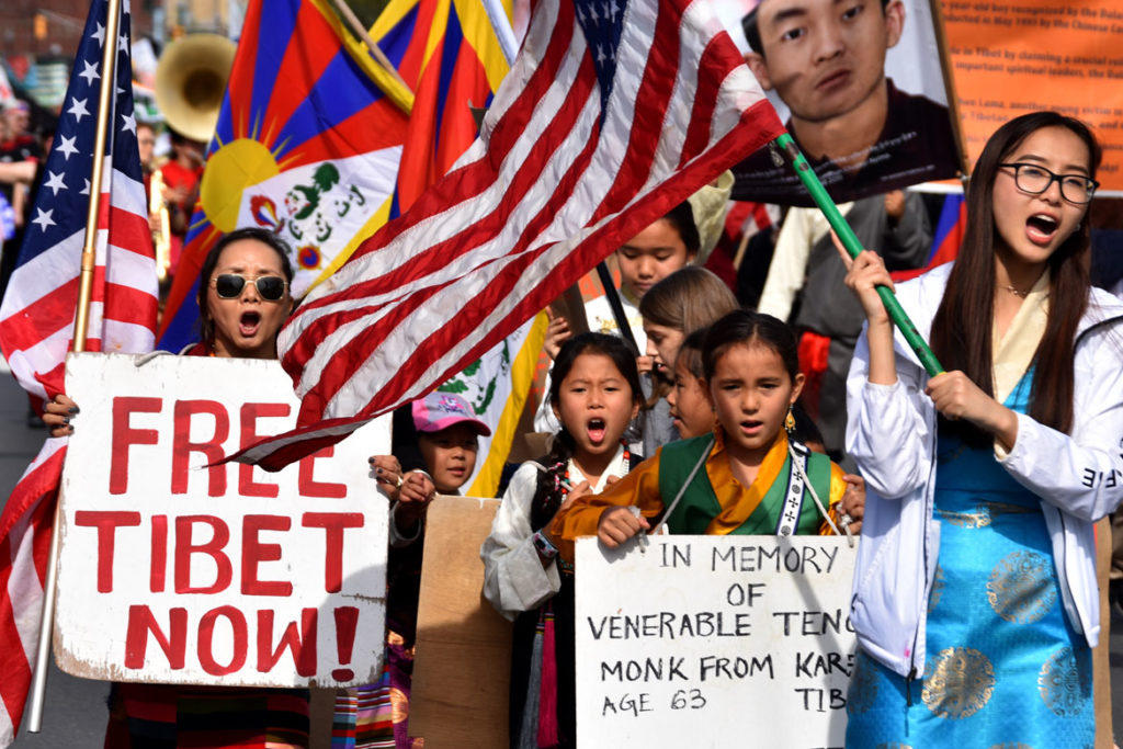 "Free Tibet Now!" activists in the Honk Parade, Oct. 13, 2019. (Greg Cook photo)