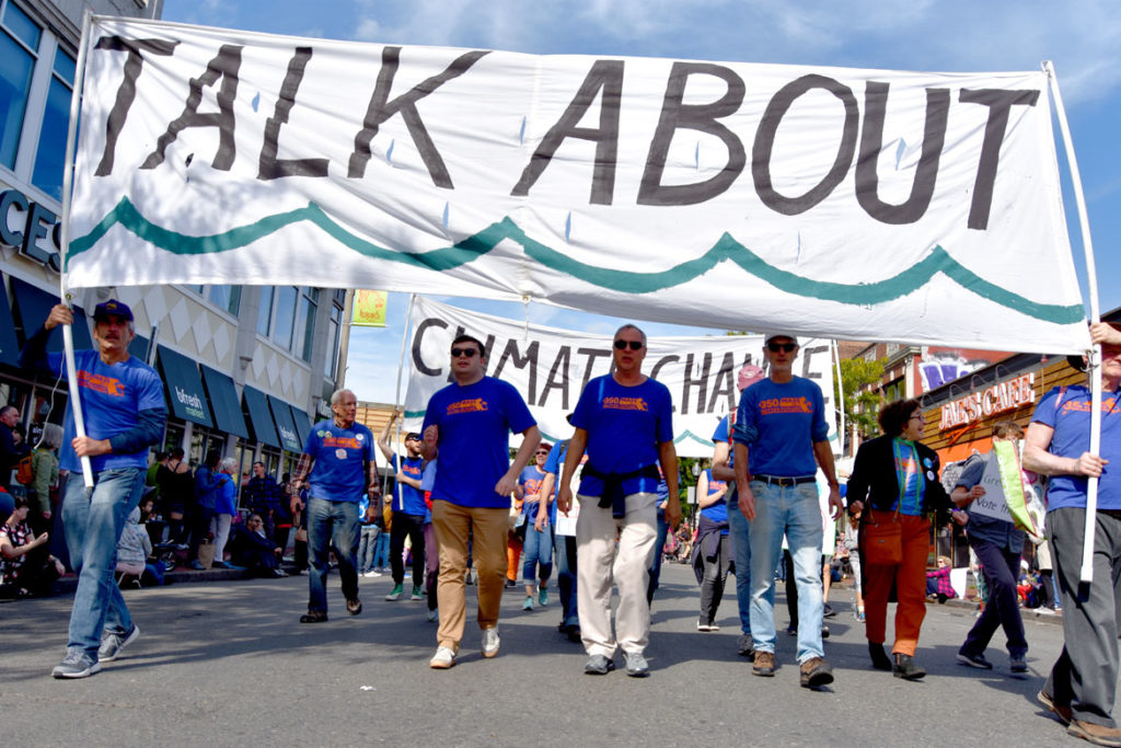 350 Mass urges people to "Talk About / Climate Change" in the Honk Parade, Oct. 13, 2019. (Greg Cook photo)