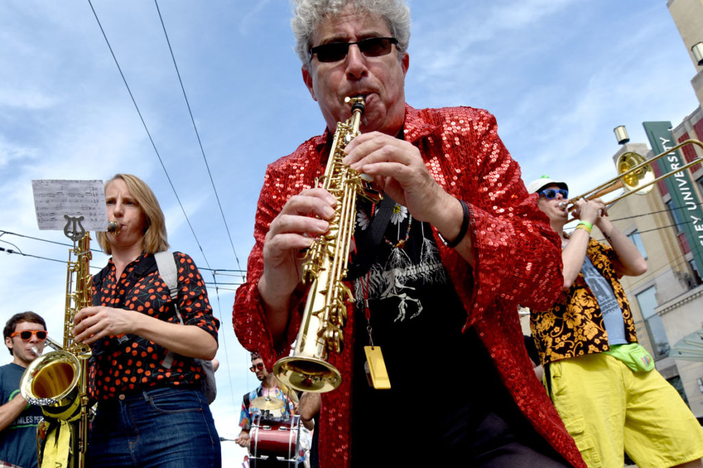 Ken Field performs in a pick-up band in the Honk Parade, Oct. 13, 2019. (Greg Cook photo)