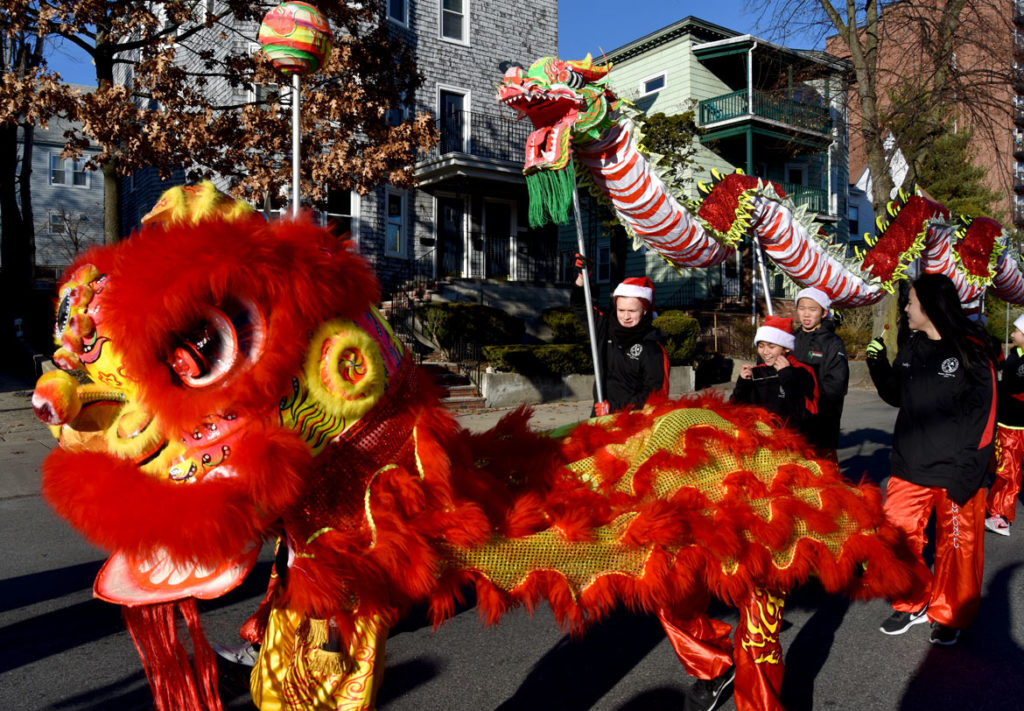 Wah Lum Kung Fu & Tai Chi Academy lion and dragon in Malden Parade of Holiday Traditions, Nov. 30, 2019. (Greg Cook photo)