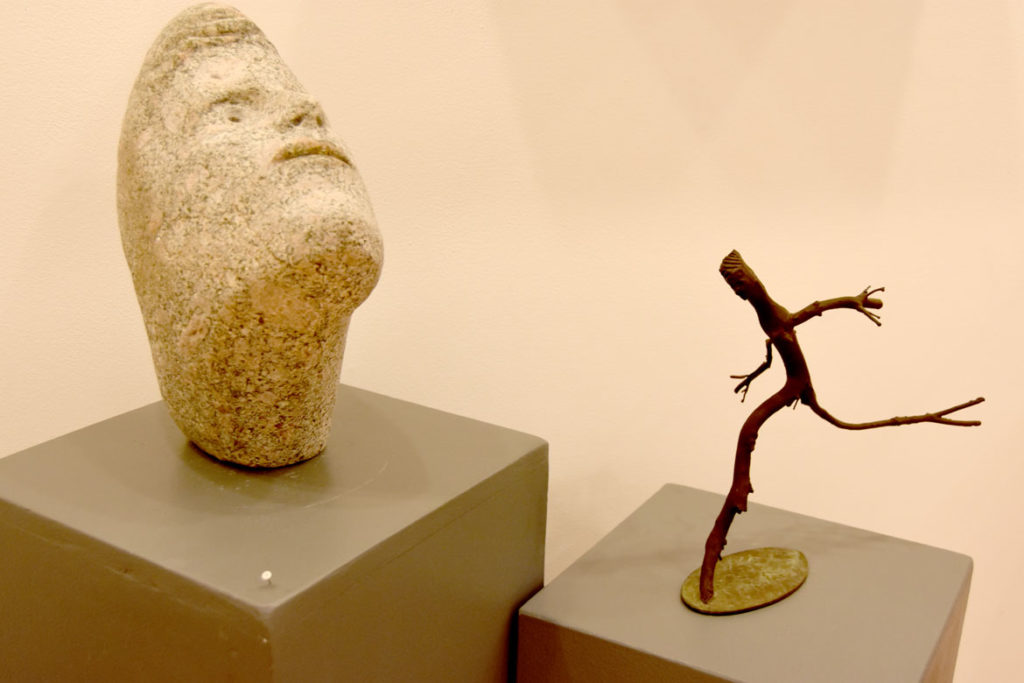 Joseph Wheelwright, "Gentle Stone,' 2014, carved stone (left), and "Dancing Twig Person," 2015, carved manzanita twigs from Tucson, Arizona. (Gallery Kayafas)