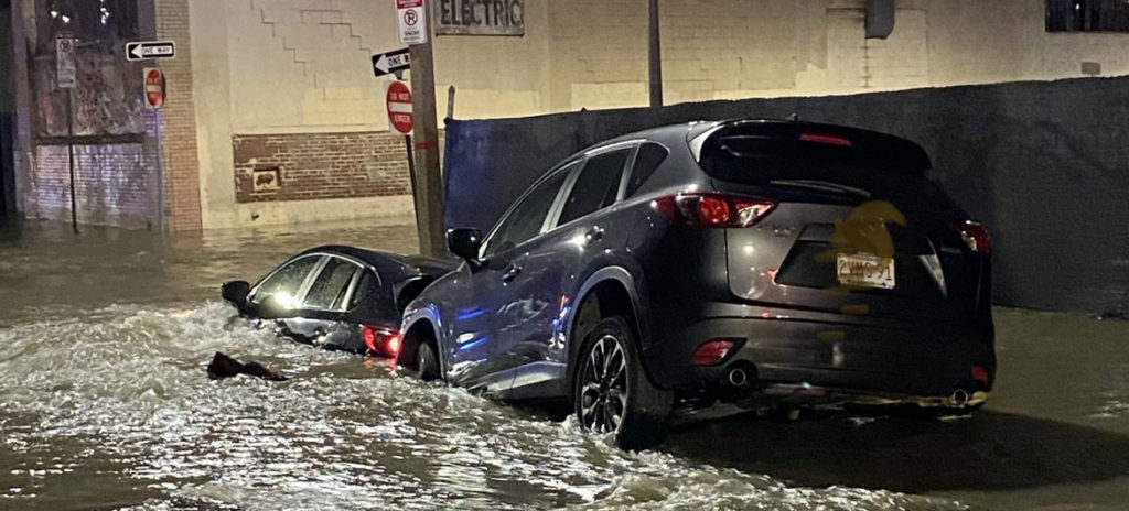 Flooding from a water main break submerged vehicles on Harrison Avenue at Perry Street in Boston, April 14, 2020. (Boston Fire Department photo)
