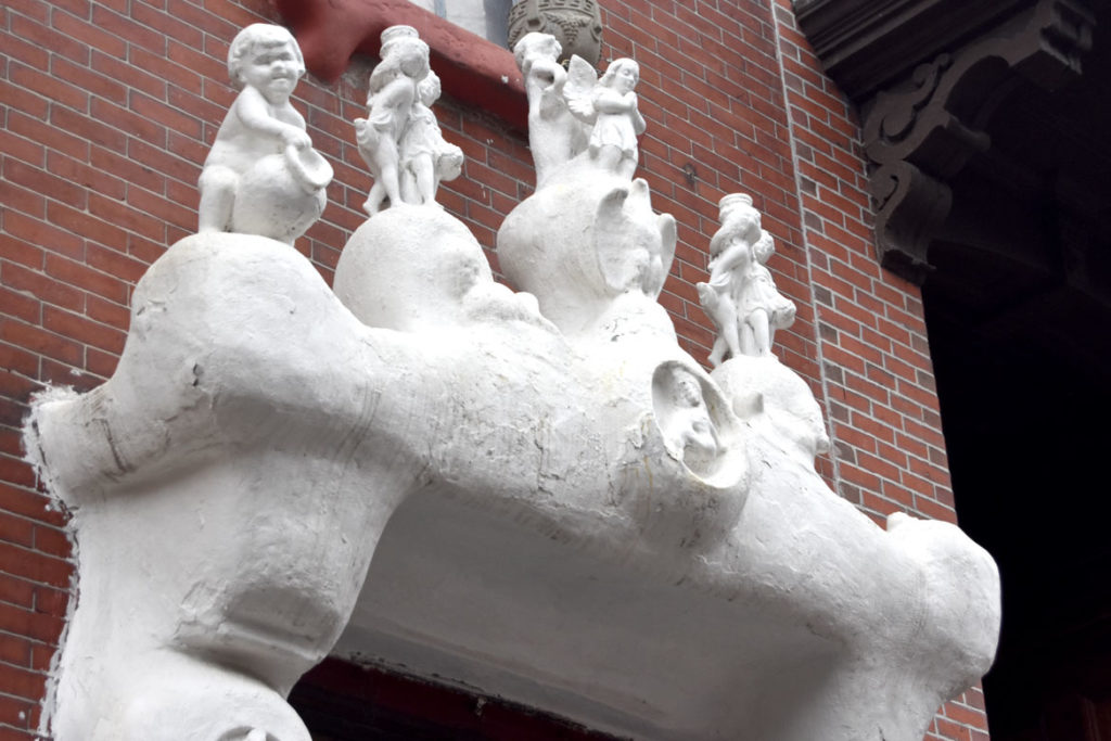 Sculptures decorate front of 9 Dwight St., Boston, Feb. 16, 2018. (Greg Cook photo)