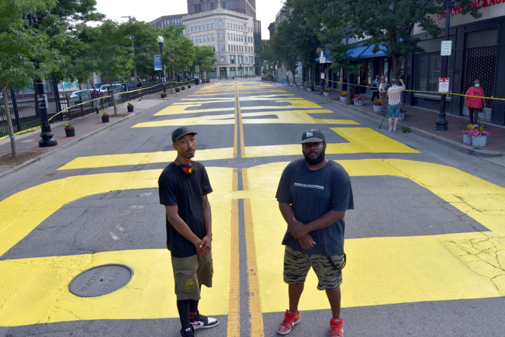 Paul “Mar” Chapman (left) and Lee Beard were lead artists for the "Black Lives Matter" street mural on Washington Street in Boston's Nubian Square, July 5, 2020. (© Greg Cook photo)
