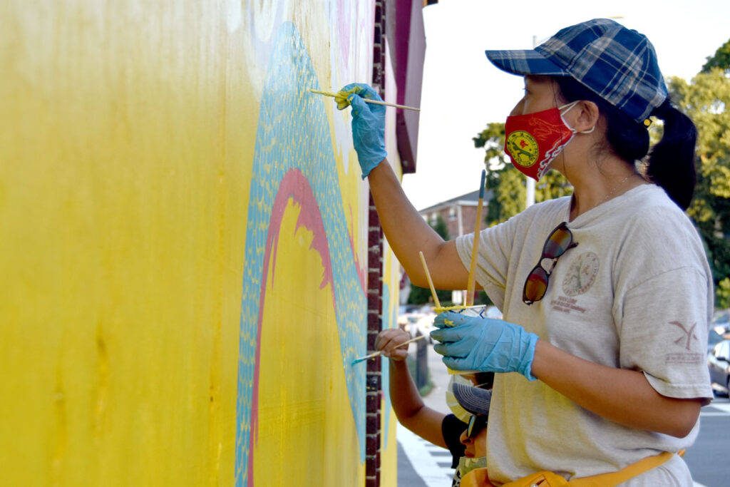 Mai Du painting mural at Wah Lum Kung Fu & Thai Chi Academy in Malden, July 25, 2020. (Photo ©Greg Cook)