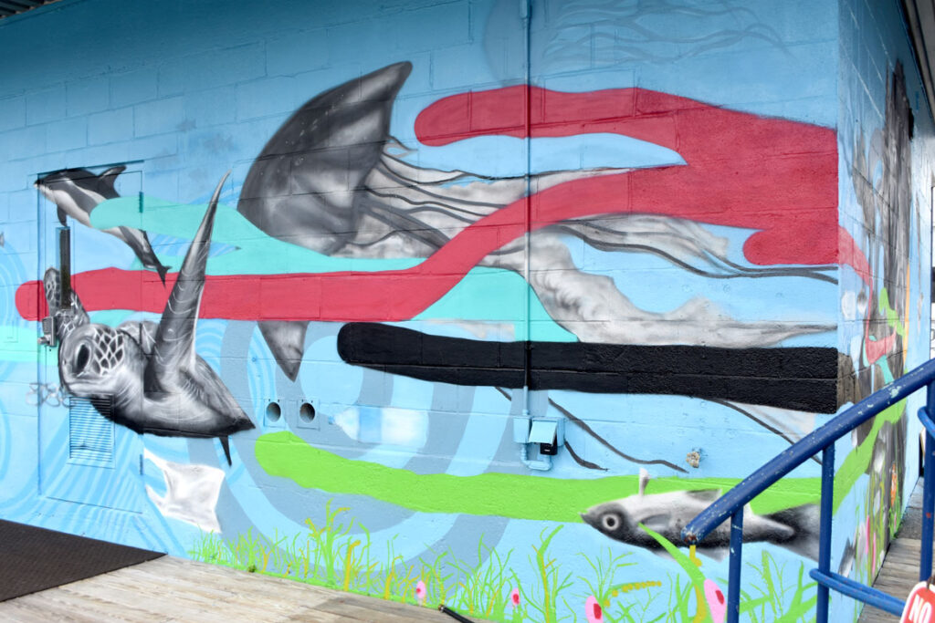 Cedric “Vise 1” Douglas and Julz Roth's mural for "Sea Walls: Artists for Oceans, Boston 2020," from PangeaSeed Foundation in collaboration with HarborArts at the Boston Harbor Shipyard in East Boston, Sept. 18, 2020. (© Greg Cook photo)