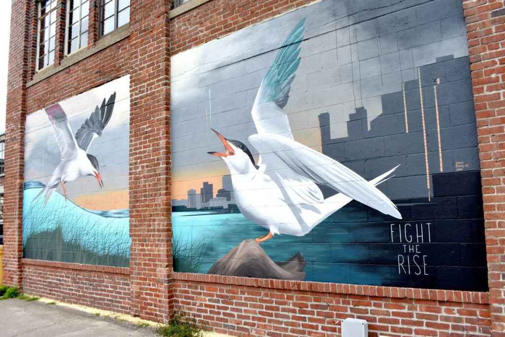 Josie Morway's mural for "Sea Walls: Artists for Oceans, Boston 2020," from PangeaSeed Foundation in collaboration with HarborArts at the Boston Harbor Shipyard in East Boston, Sept. 18, 2020. (© Greg Cook photo)
