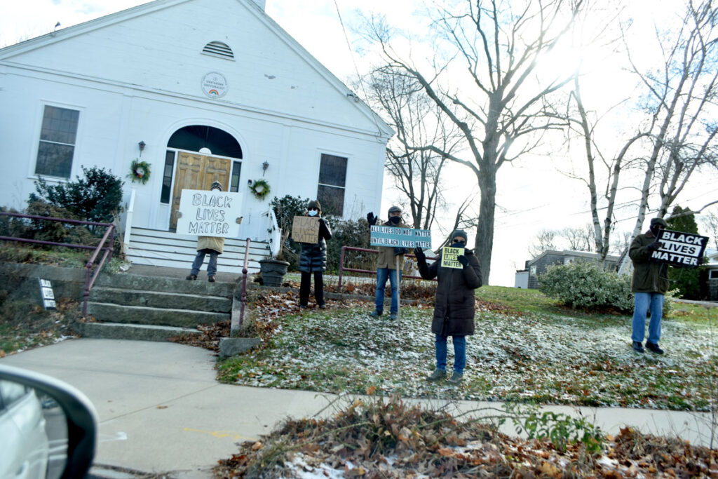 Black Lives Matter activists in front of First Universalist Church of Essex, Dec. 6, 2020. (©Greg Cook photo)