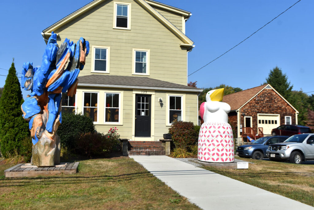 Sculptures by Andy Merlin (left) and Donna Dodson (right) on the lawn of their Summer Street home in Maynard, Sept. 29, 2020. (©Greg Cook photo)