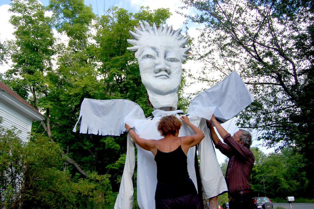 Remi Paillard (right) and his partner Genevieve prepare a puppet at the Bread and Puppet farm, Glover, Vermont, Aug. 13, 2009. (©Greg Cook photo)
