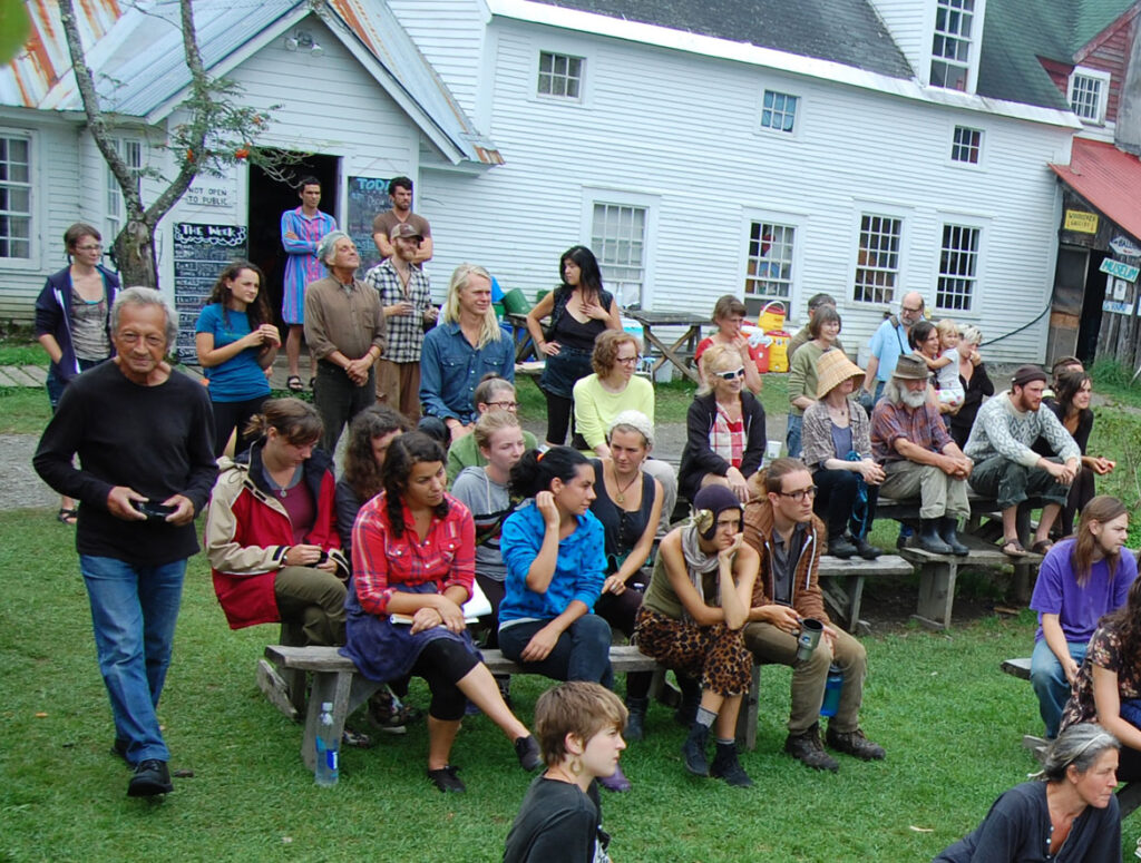 Remi Paillard (left) photographs a rehearsal for the Bread and Puppet Circus, Glover, Vermont, Aug. 21, 2015. (©Greg Cook photo)
