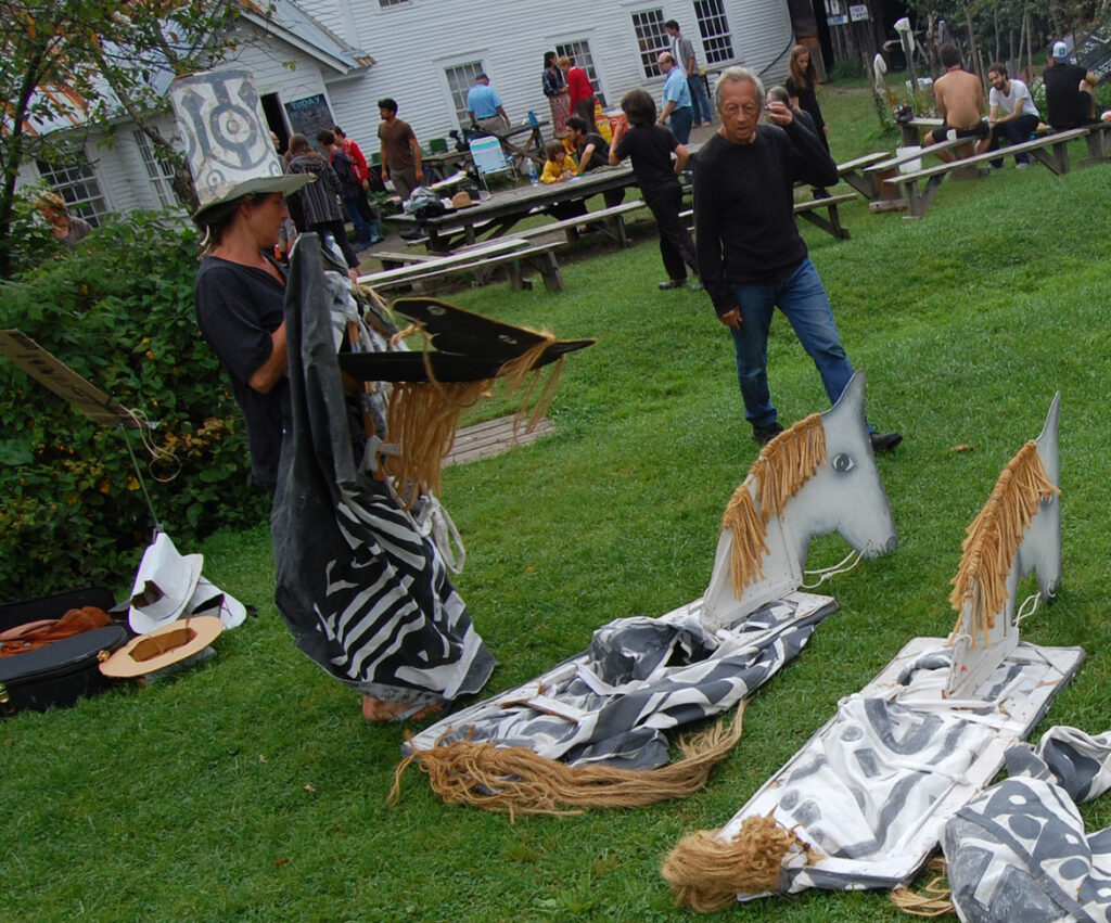 Remi Paillard (right) at a rehearsal for the Bread and Puppet Circus, Glover, Vermont, Aug. 21, 2015. (©Greg Cook photo)