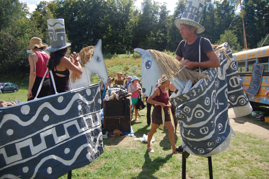 Remi Paillard (right) prepares to rehearse the Bread and Puppet Circus, Glover, Vermont, Aug. 22, 2015. (©Greg Cook photo)