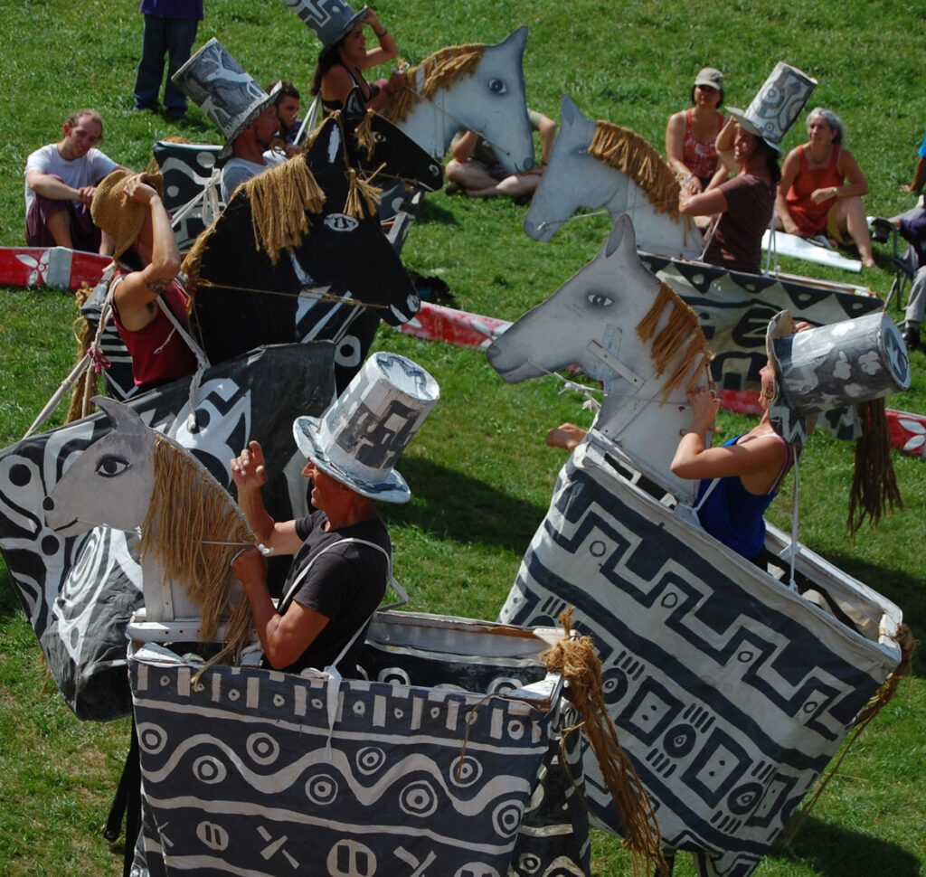 Remi Paillard (foreground) performs in a rehearsal for the Bread and Puppet Circus, Glover, Vermont, Aug. 22, 2015. (©Greg Cook photo)
