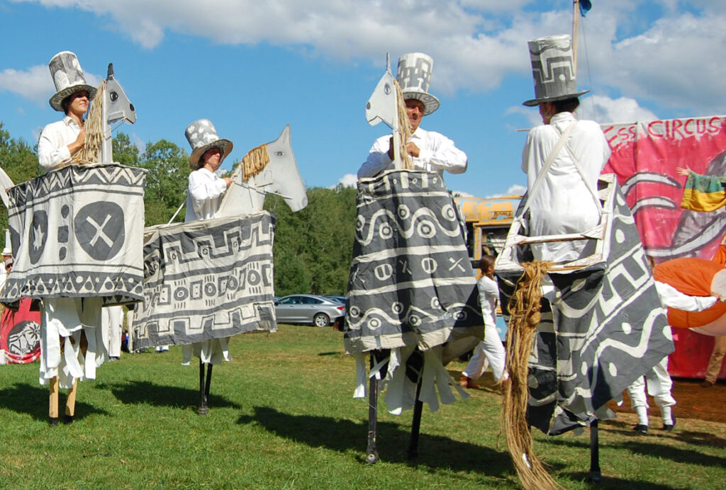 Remi Paillard (center) performs in the Bread and Puppet Circus, Glover, Vermont, Aug. 23, 2015. (©Greg Cook photo)