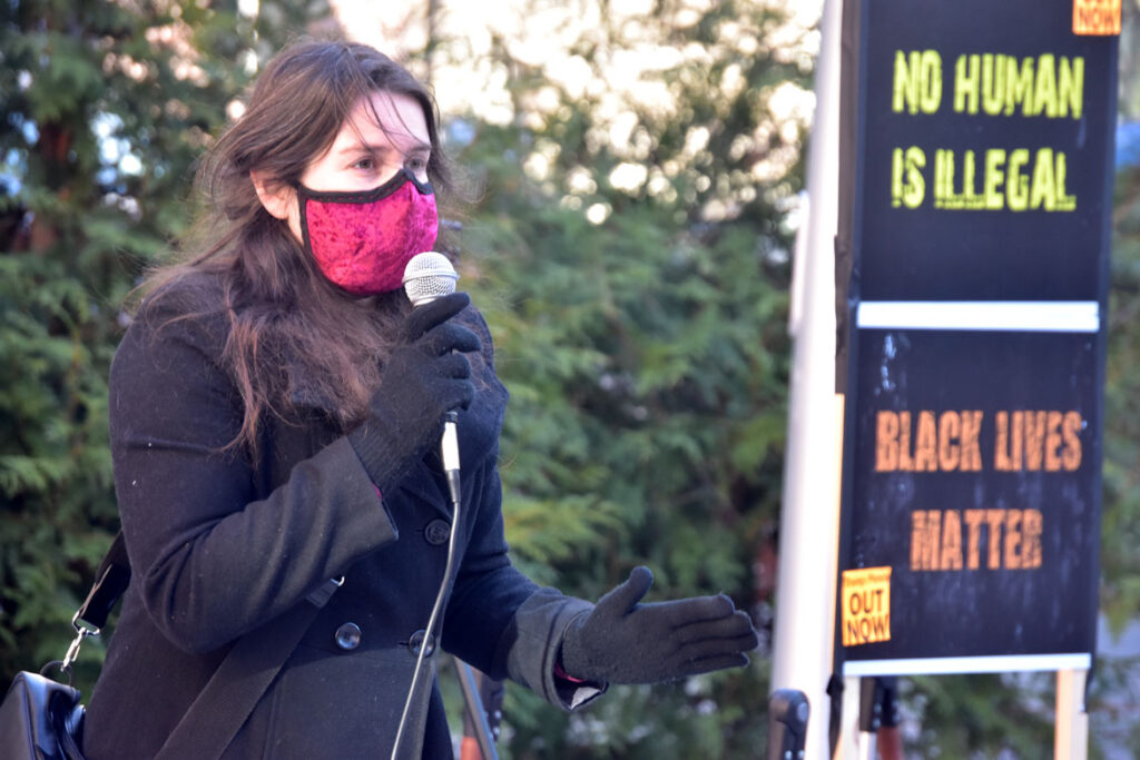 Anna Geoffroy speaks at the Malden Rejects the Coup rally at Malden City Hall, Jan. 10, 2021. (©Greg Cook photo)