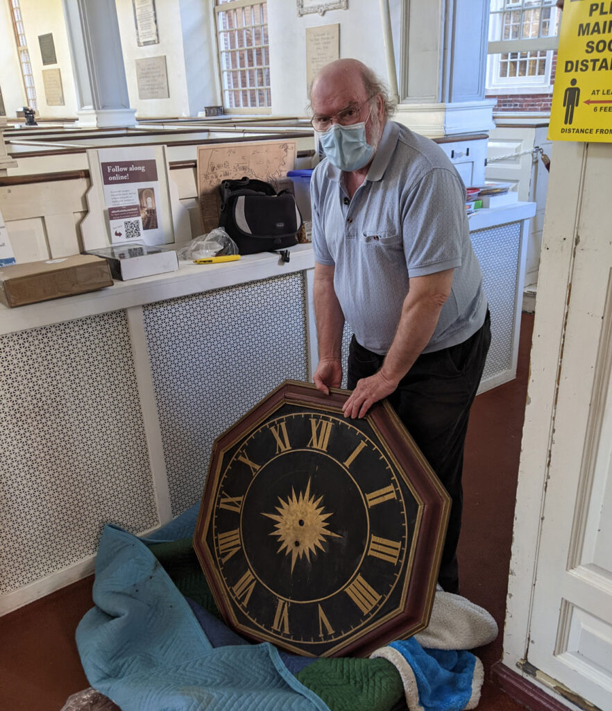 Ken Pearson holds the repaired 1726 Avery-Bennett clock at Boston's Old North Church on June 16, 2021. (Courtesy Old North Church & Historic Site)
