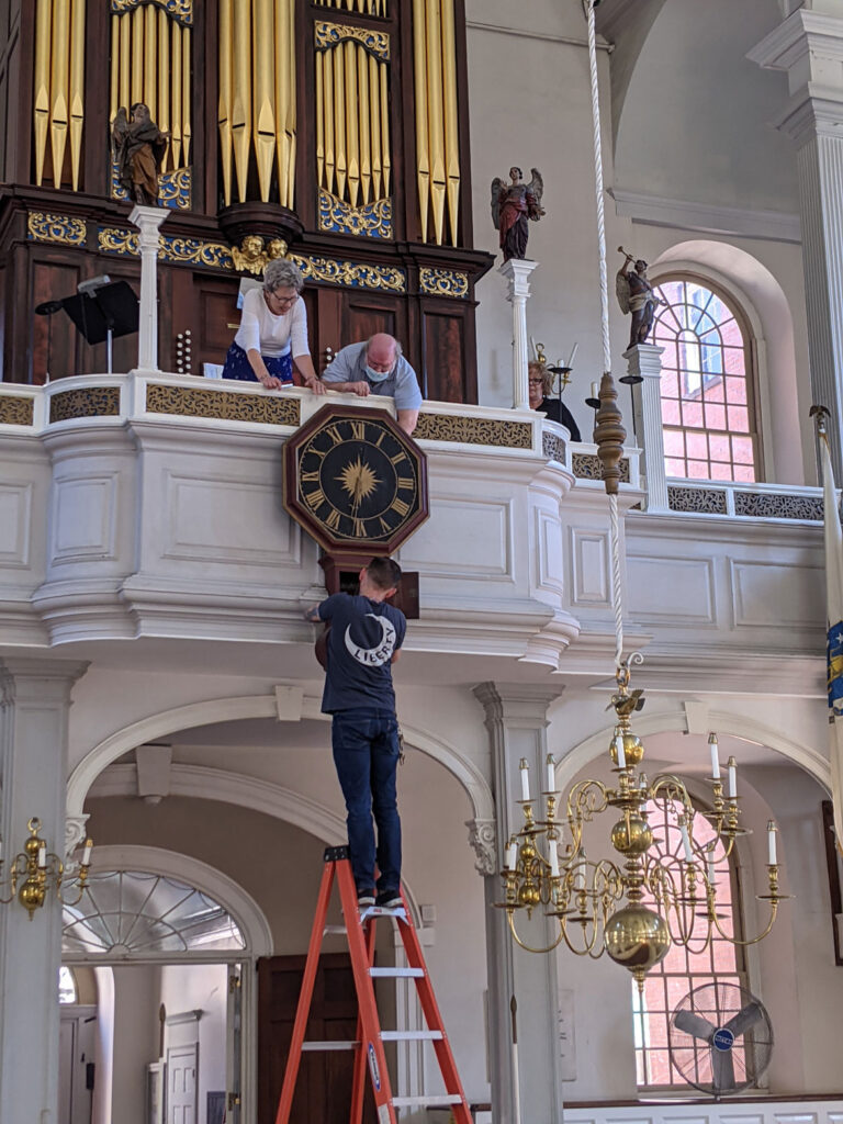 Re-installing the repaired 1726 Avery-Bennett clock at Boston's Old North Church on June 16, 2021. (Courtesy Old North Church & Historic Site)