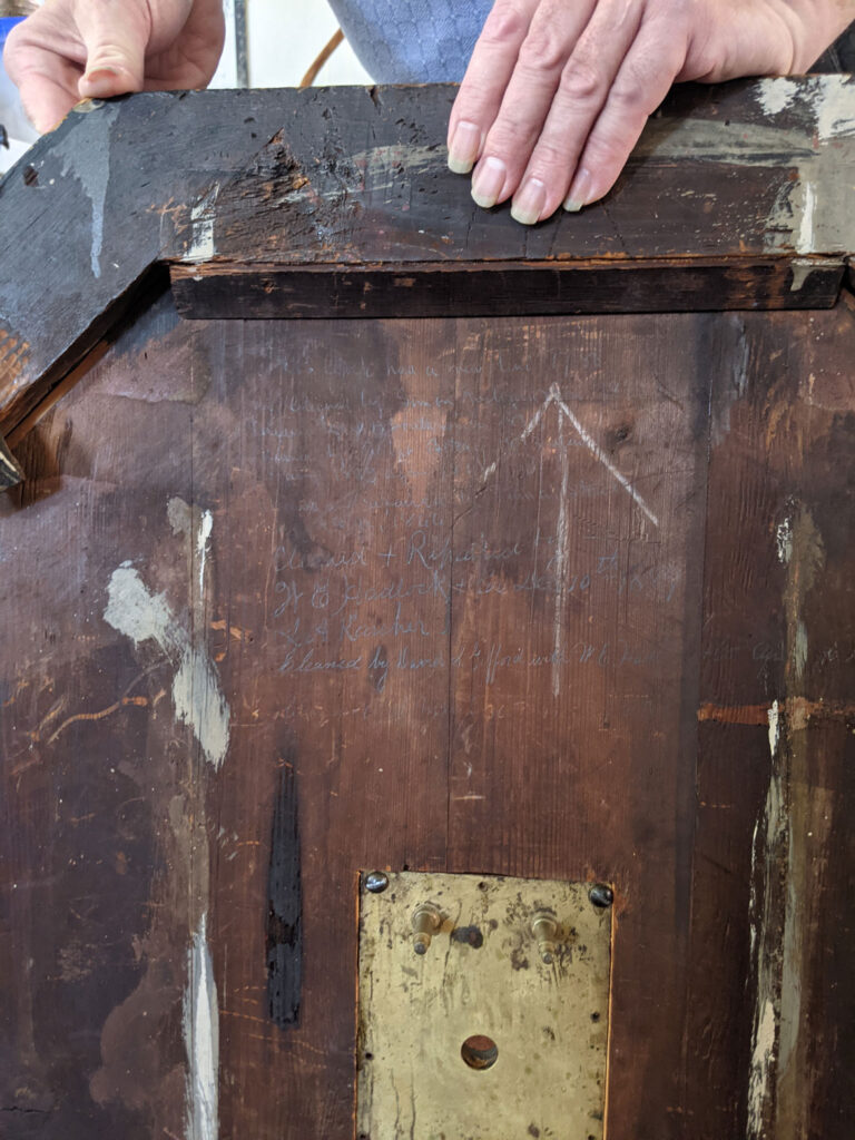 A history of artisans who worked on or repaired the Old North Church's 1726 Avery-Bennett clock is written on the back. (Courtesy Old North Church & Historic Site)