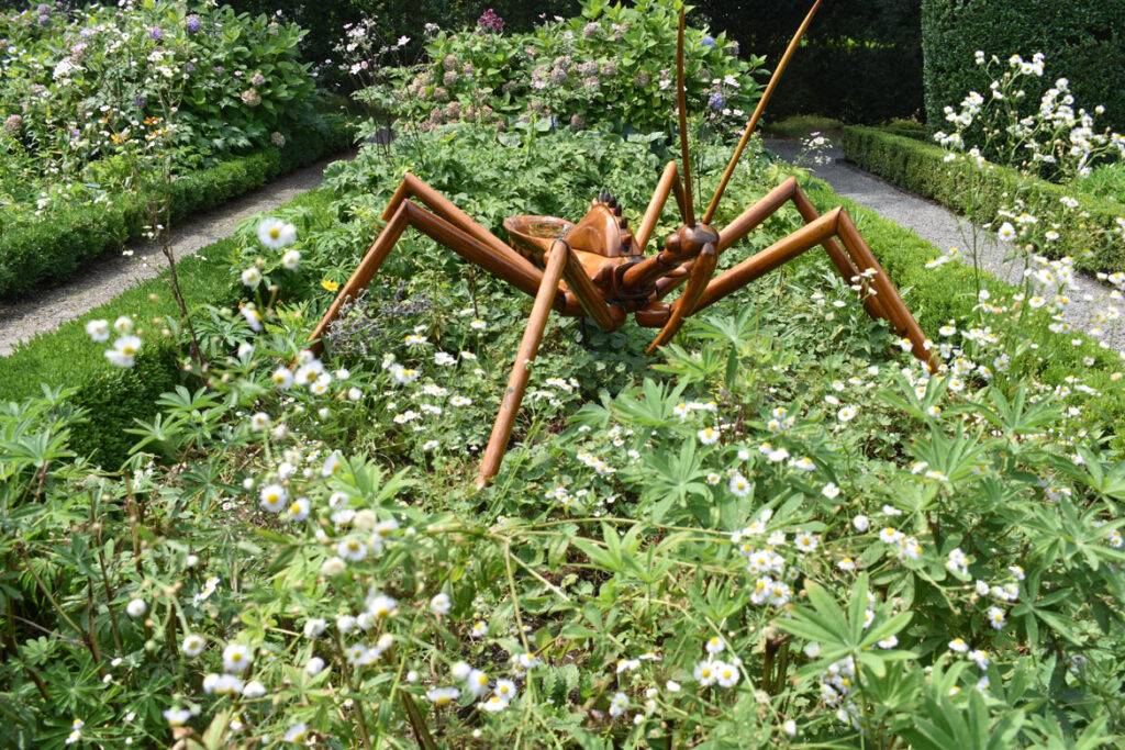 "Assassin Bug" in David Rogers's "Big Bugs" at Green Animals Topiary Garden, Portsmouth, Rhode Island, August 2021. (©Greg Cook photo)
