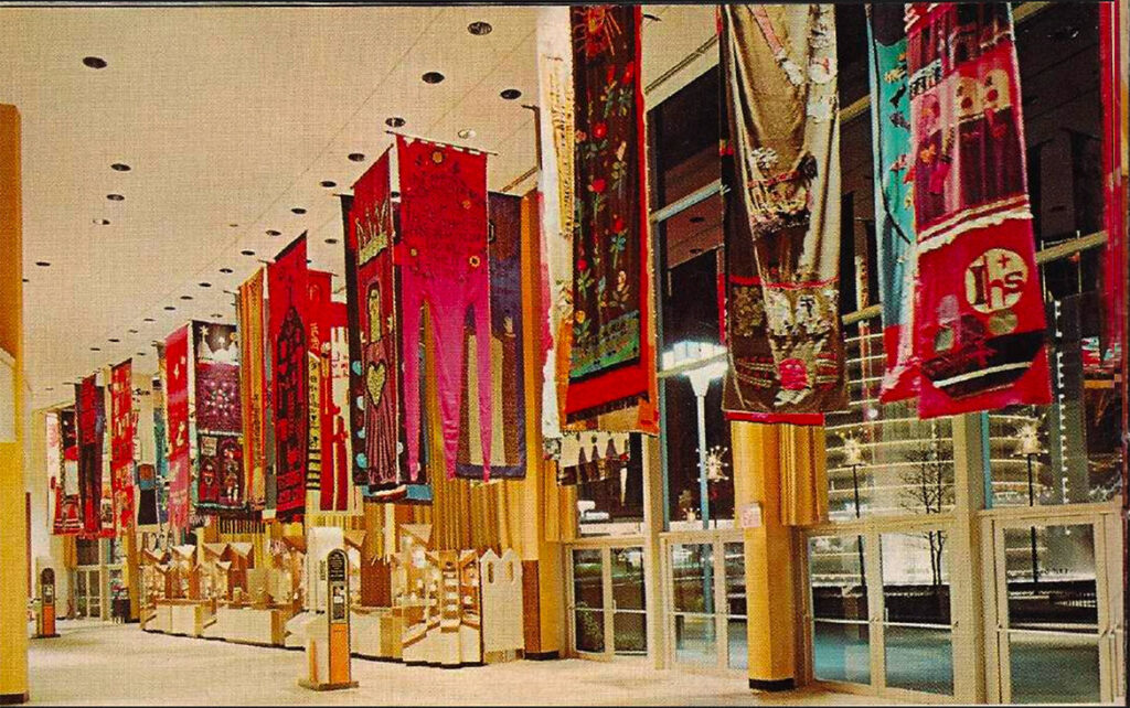 Norman Laliberte's banners in the main concourse of the Vatican Pavilion at the 1964 to ‘65 New York World’s Fair. (from “Official Guide Book: Vatican Pavilion, New York World’s Far 1965-1965")
