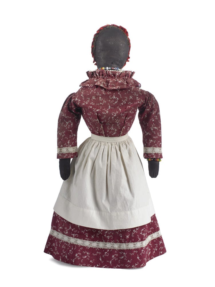 Doll with apron, late 19th century