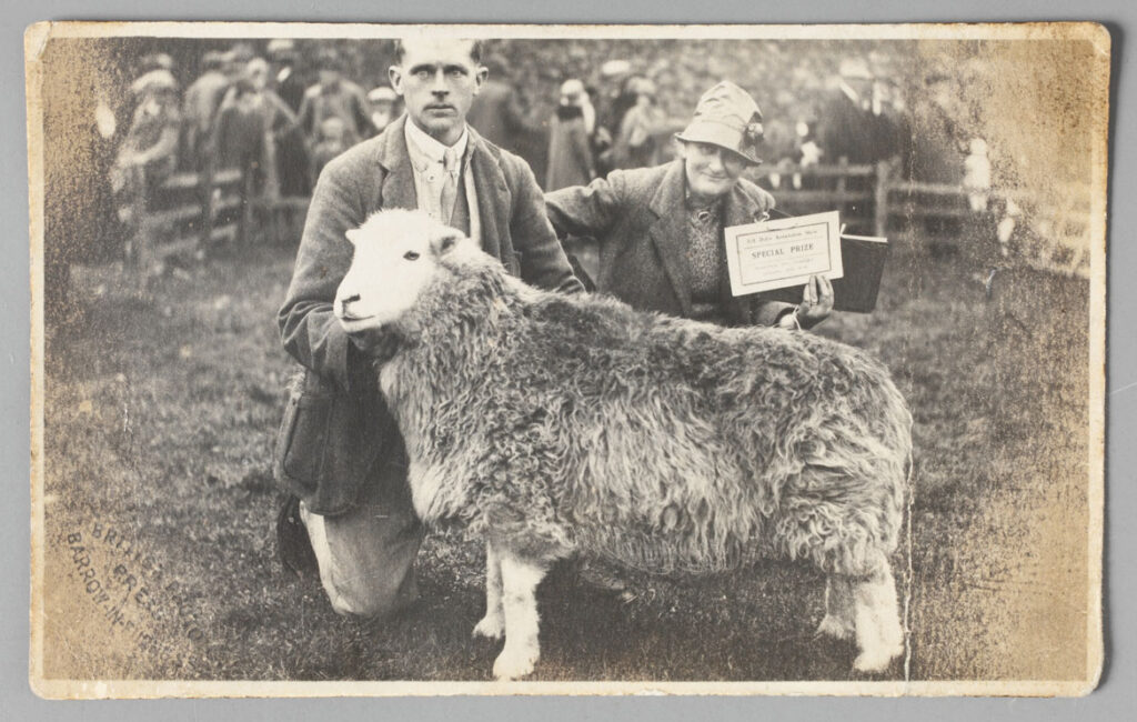 Tom Storey and Beatrix Heelis with prize-winning ewe named ‘Water Lily’, at the Eskdale Show, 26 September 1930. Photographic print, published by the British Photo Press. © National Trust Images