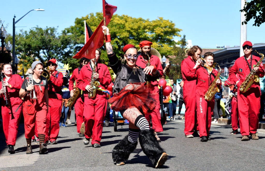 The Brass Balagan from Burlington, Vermont, performs in the Honk parade from Somerville's Davis Square to Cambridge's Harvard Square, Sunday, Oct 9, 2022 (©Greg Cook photo)