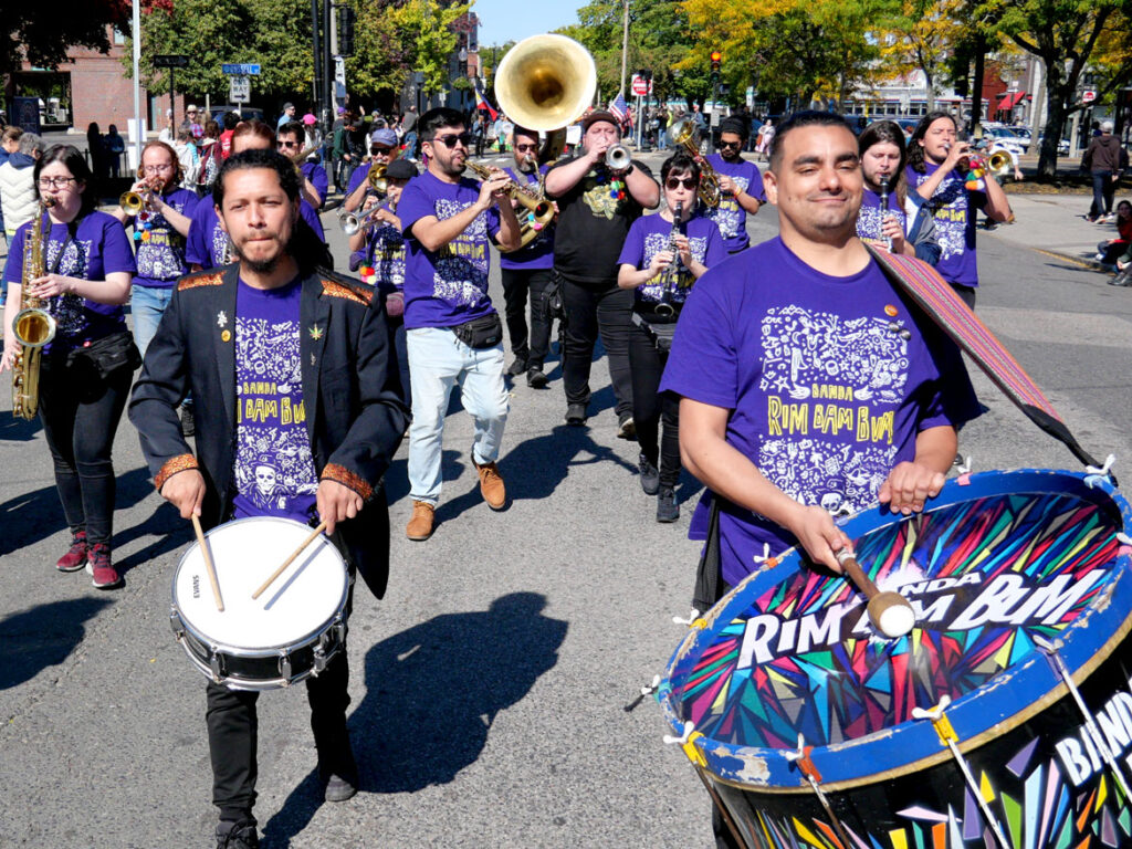 Banda Rim Bam Bum from Santiago, Chile, performs in the Honk parade from Somerville's Davis Square to Cambridge's Harvard Square, Sunday, Oct 9, 2022 (©Greg Cook photo)