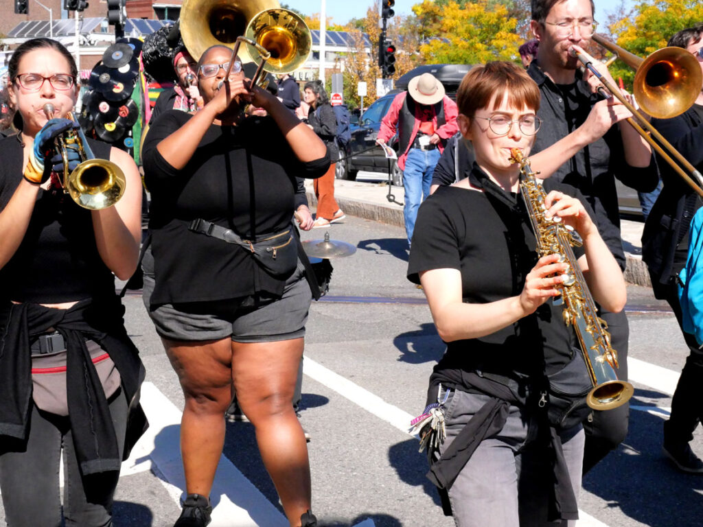 Undertow Brass Band from Providence performs in the Honk parade from Somerville's Davis Square to Cambridge's Harvard Square, Sunday, Oct 9, 2022 (©Greg Cook photo)