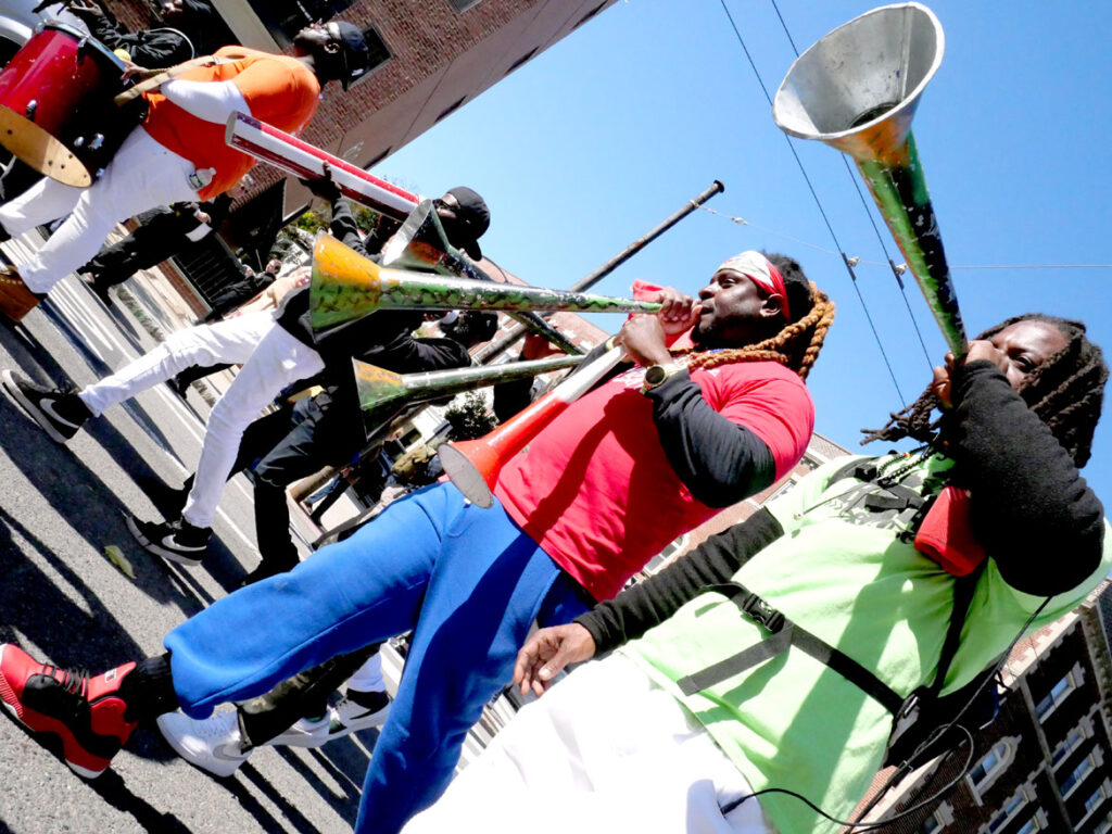 Rara Bel Poze from Boston performs in the Honk parade from Somerville's Davis Square to Cambridge's Harvard Square, Sunday, Oct 9, 2022 (©Greg Cook photo)