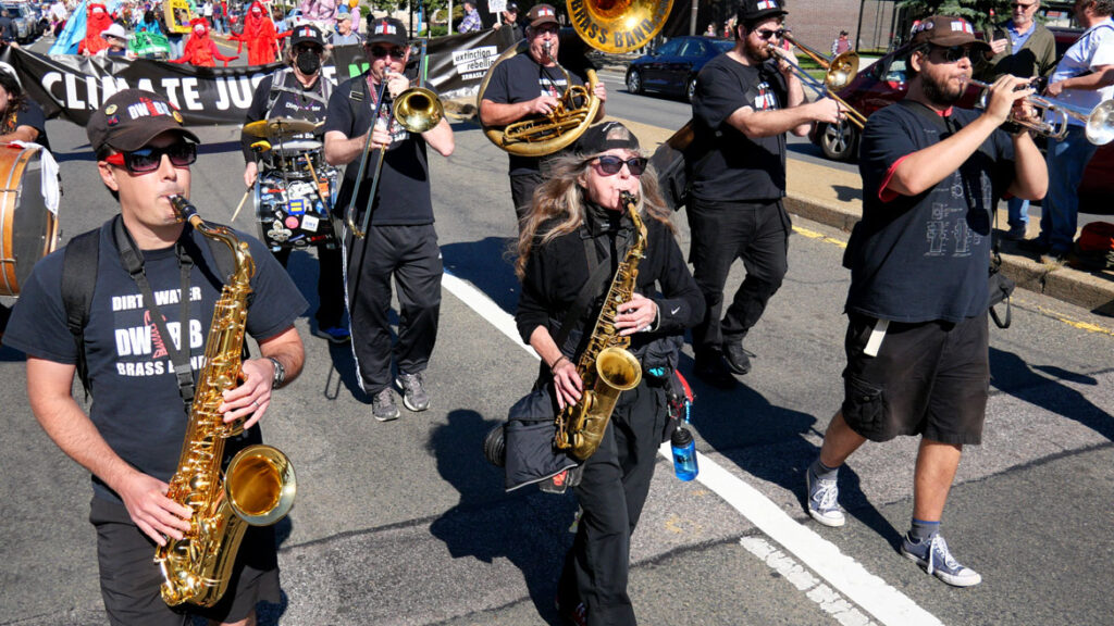 Dirty Water Brass Band from Boston performs in the Honk parade from Somerville's Davis Square to Cambridge's Harvard Square, Sunday, Oct 9, 2022 (©Greg Cook photo)