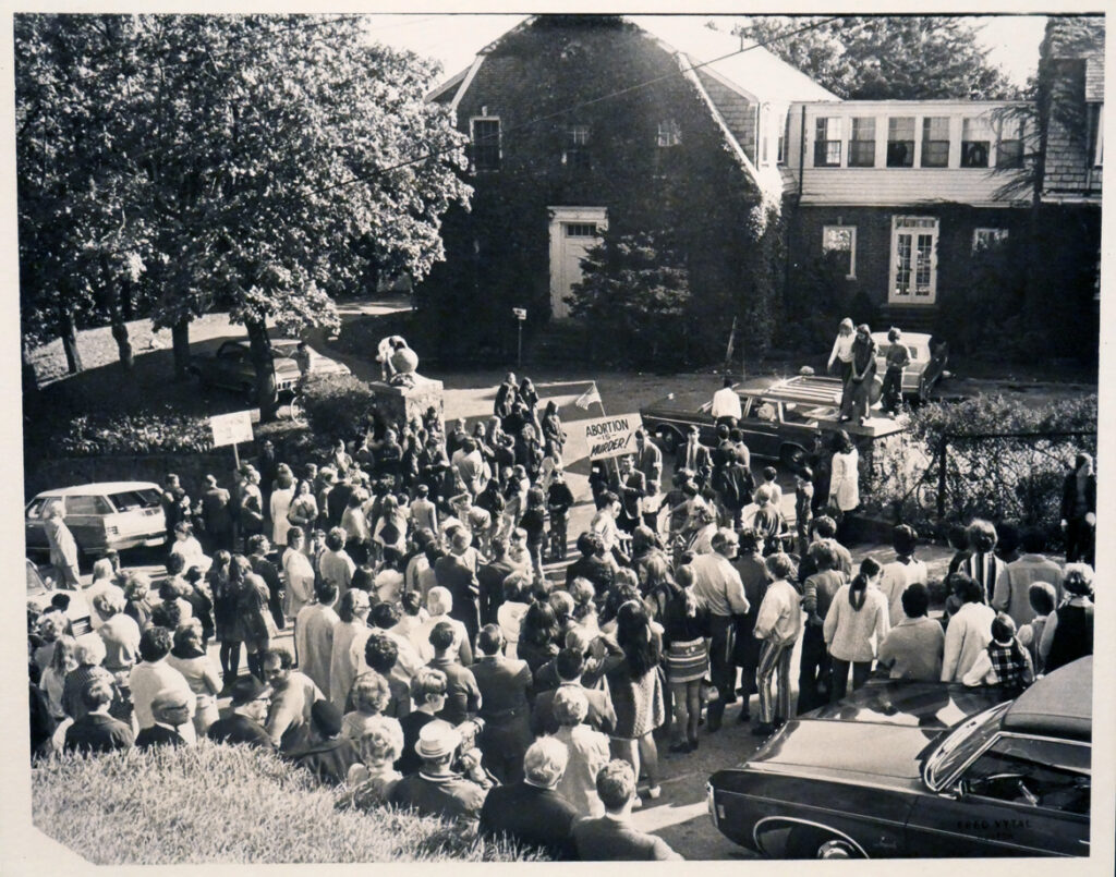 Pro-life protesters outside a residence, massachusetts, photograph by Fred Vytal, c. 1971. In "The Age of Roe: The Past, Present, and Future of Abortion in America" at Harvard Radcliffe Institute Schlesinger Library's Poorvu Gallery.