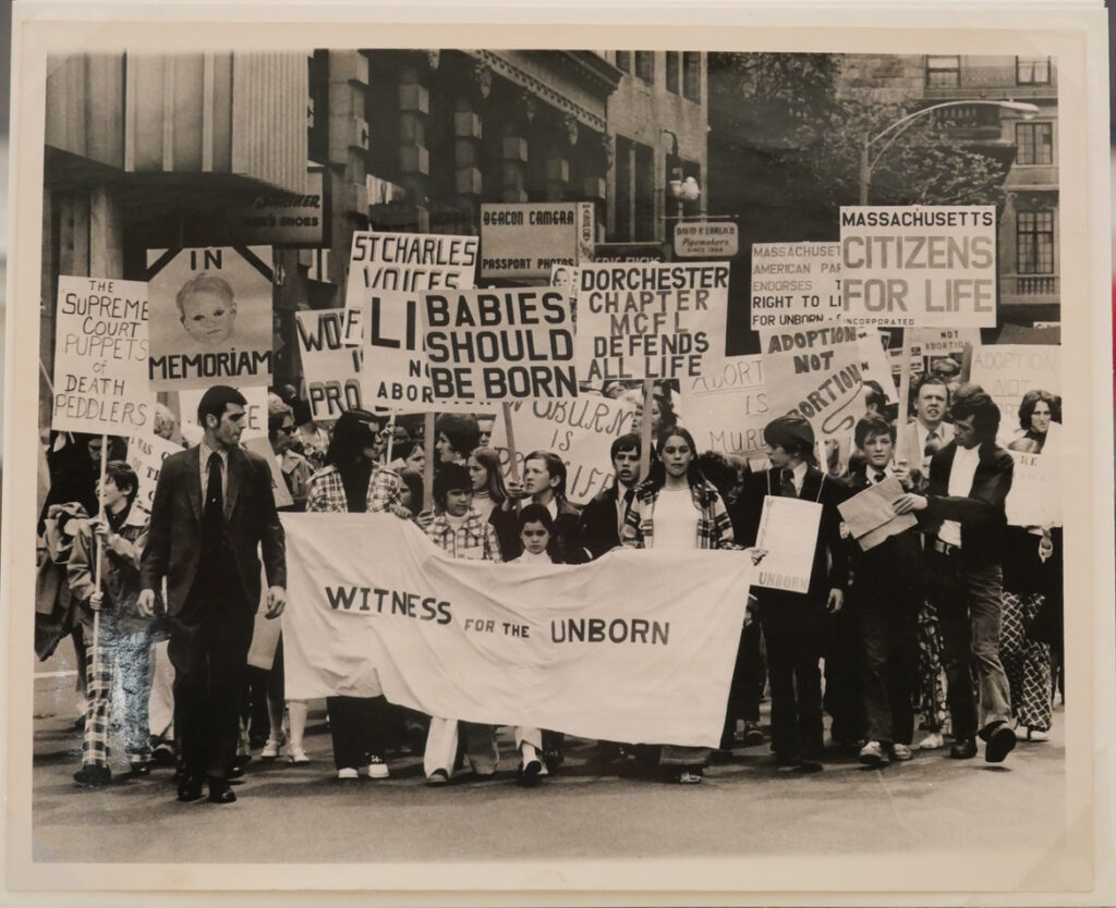 "Witness for the Unborn," pro-life march, Boston, c 1975. In "The Age of Roe: The Past, Present, and Future of Abortion in America" at Harvard Radcliffe Institute Schlesinger Library's Poorvu Gallery.