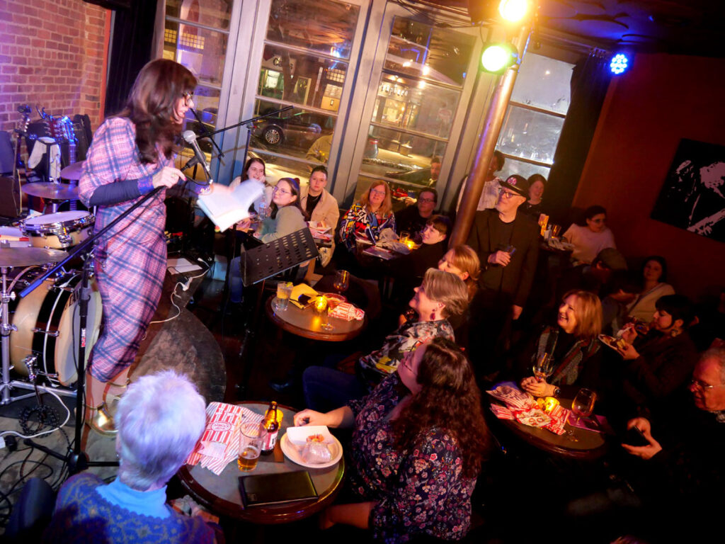 Colleen Michaels reads from her poetry book "Prize Wheel" at Chianti in Beverly, Jan. 21, 2023. (©Greg Cook photo)